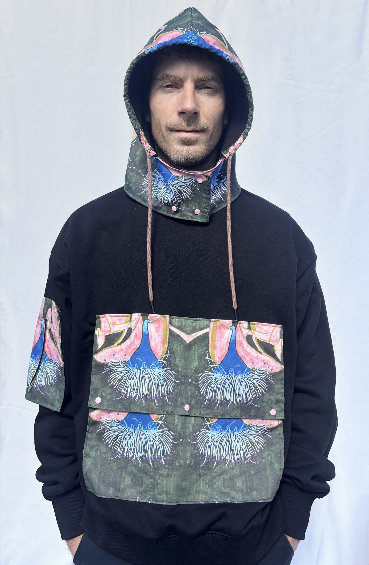 Finished hoodie in wear, showing the printed panel as a worn garment