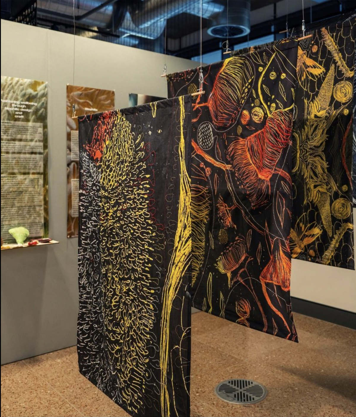 Ember and Bloom exhibition, hanging hand-printed and embroidered textiles